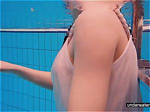 nubile dame Avenna is swimming in the pool